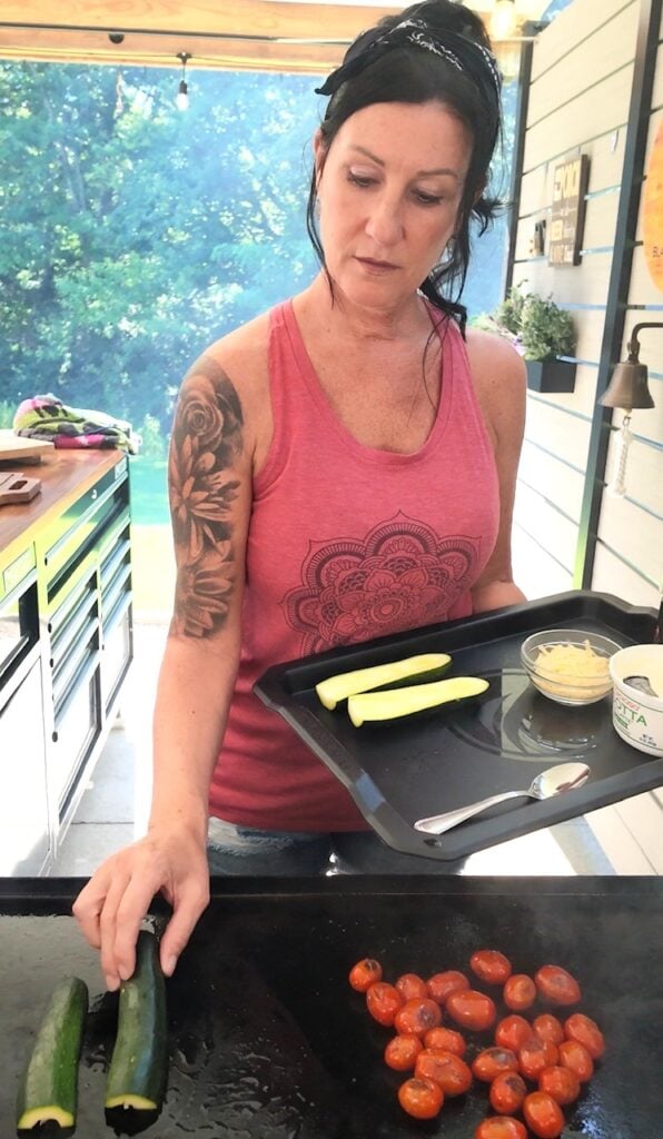 adding zucchini to griddle