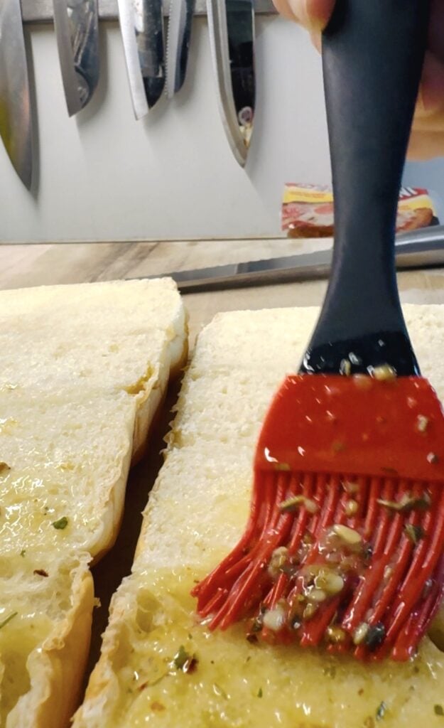 brushing butter on the rolls