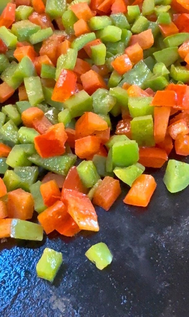 peppers cooking on the griddle